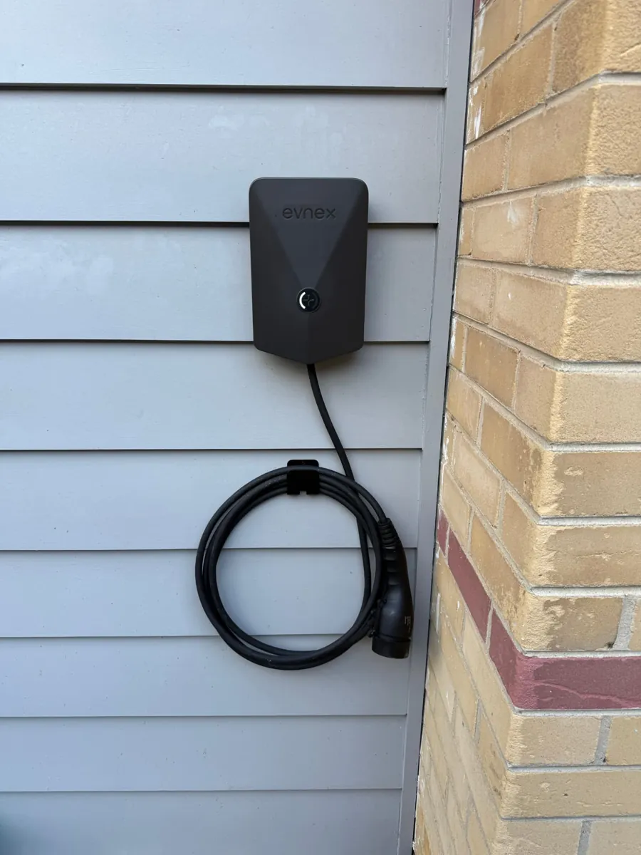 Evnex EV charger installed on weatherboard cladding