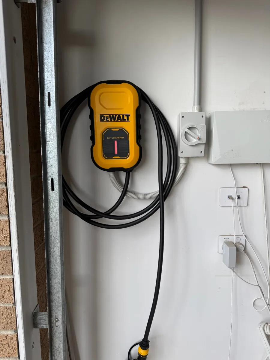 DeWalt EV charger installed beside a garage door